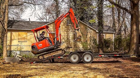 how to load a mini excavator on a trailer|unloading mini excavator on trailer.